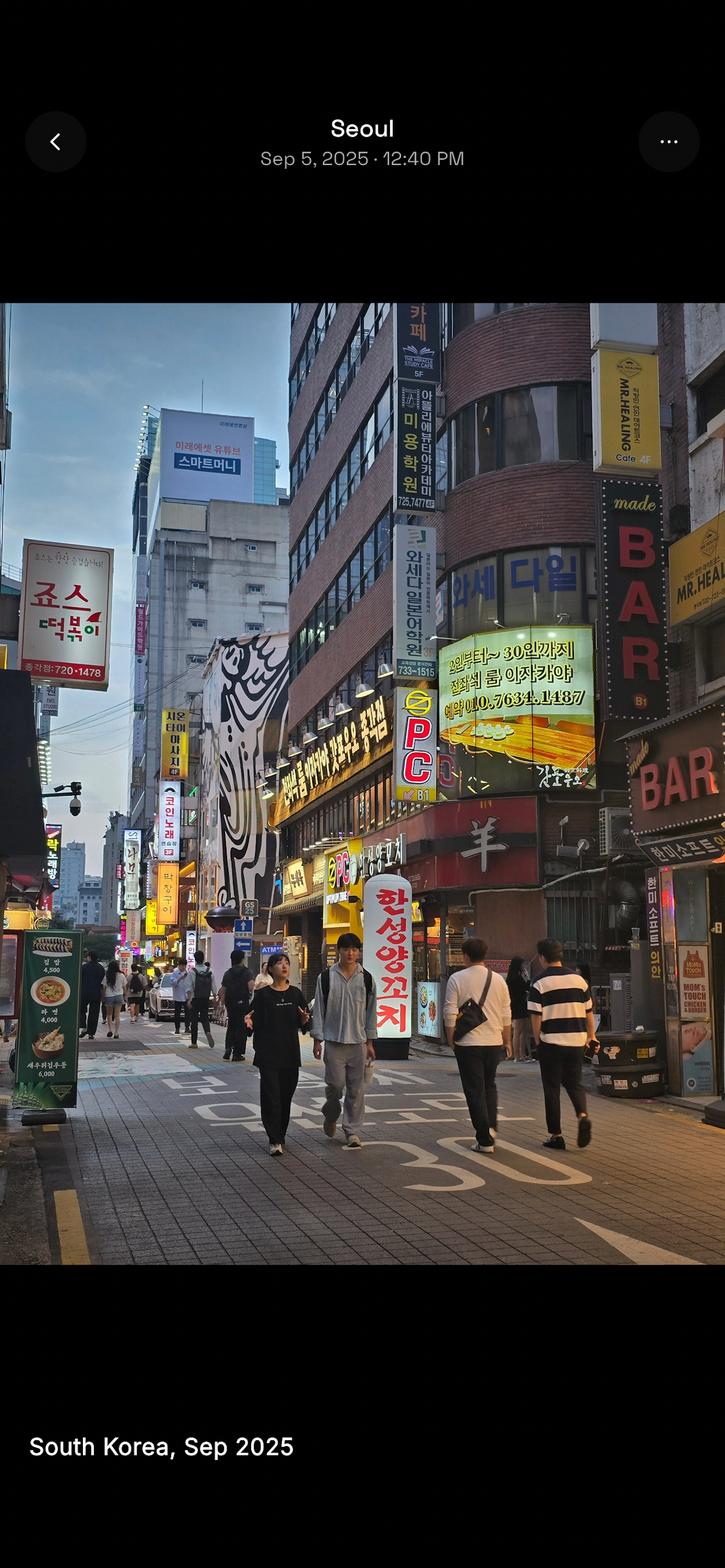 A dusk street scene in Seoul, South Korea, viewed in Citybrk's photo viewer